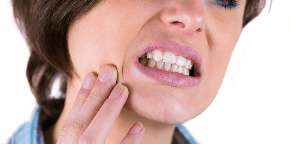 What To Do If You Have a Cracked or Broken Tooth – Emergency Dental AdviceOral Dental Square Person holding jaw and experiencing pain from a cracked or broken tooth requiring urgent dental treatment at Oral Dental Square Tarneit