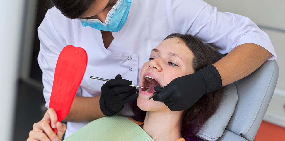 High Quality Dental Fillings at Oral Square Dental Care Dentist performing a dental filling check-up for a patient during a dental examination in Tarneit